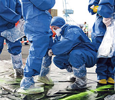 Participants putting on protective equipment during an emergency exercise in Nantes (Loire-Atlantique d�partement) - October 2007